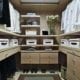Walk-in closet with extra storage from drawers and shelves