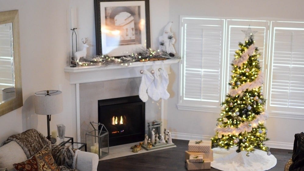 Living room decorated with glam white Christmas decor.