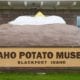 A sign made to look like a potato that reads "Idaho Potato Museum, Blackfoot, Idaho."