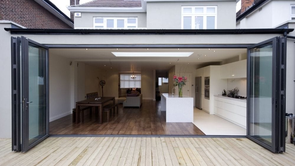 An extended kitchen with folding doors opened to the patio.