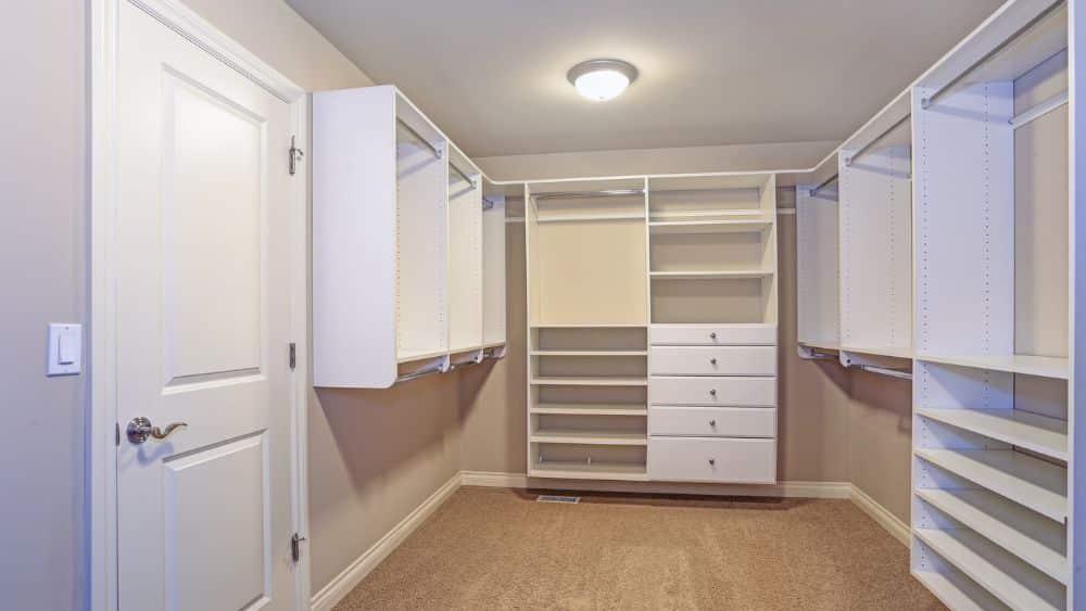 Empty closet with shelves, drawers, and rods that can be moved,