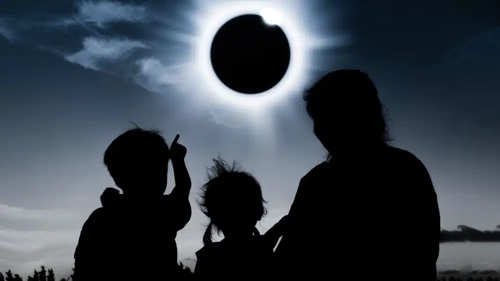 family watching a solar eclipse